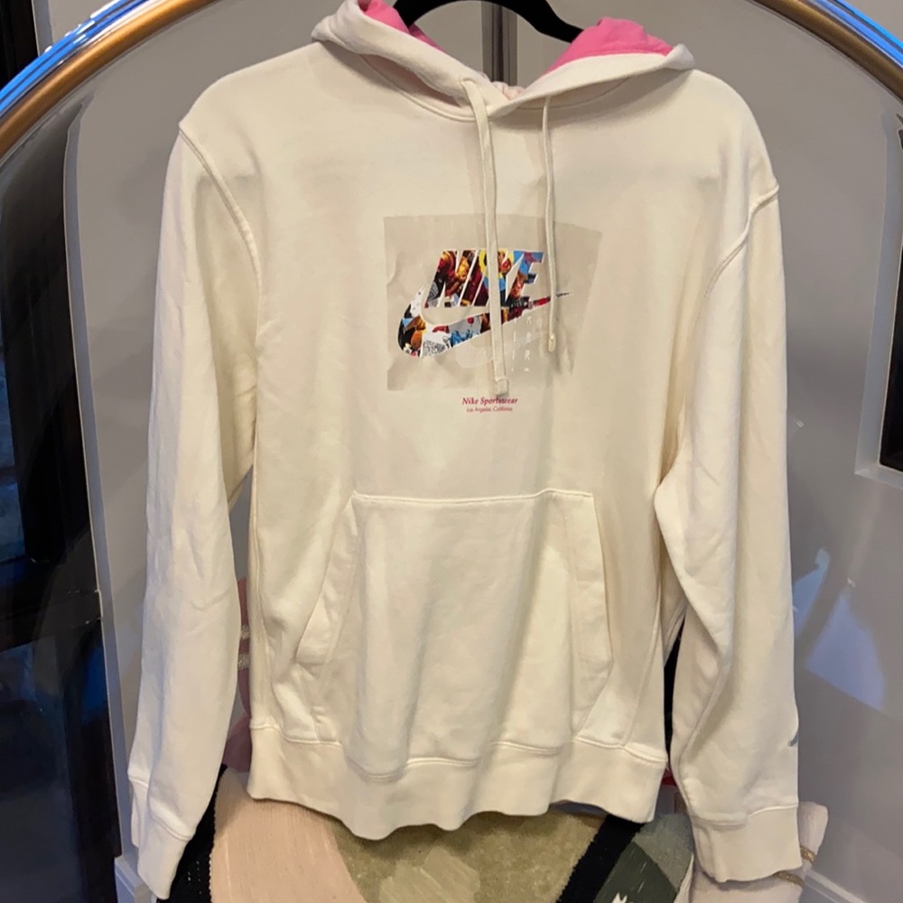 White graphic Nike hoodie with pink hood